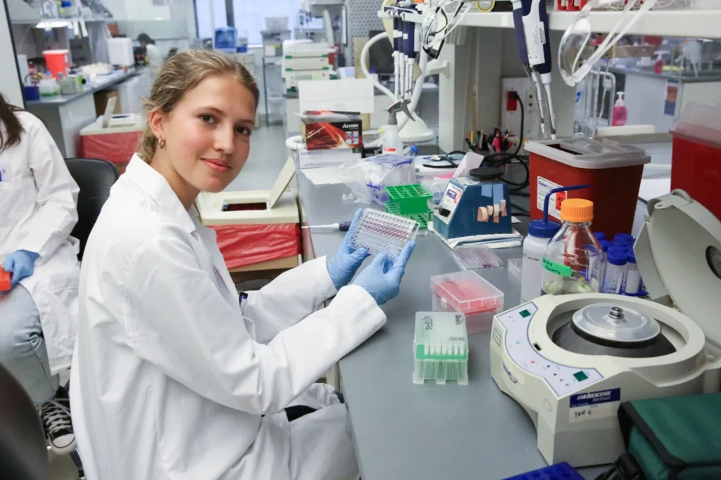 Image of a young scientist at the bench at ISB.