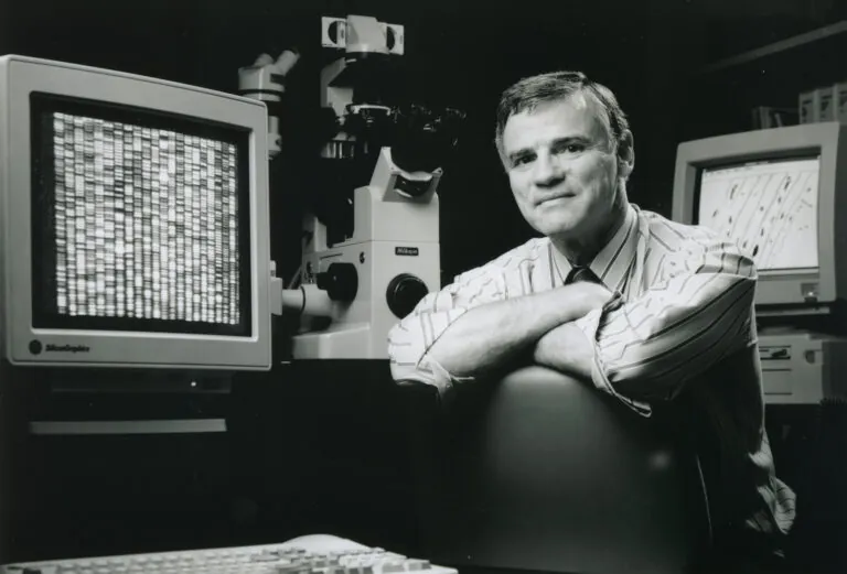 Dr. Lee Hood pictured with one of his first generation DNA sequencers.