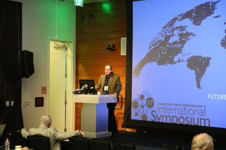 man on a stage giving a presentaion