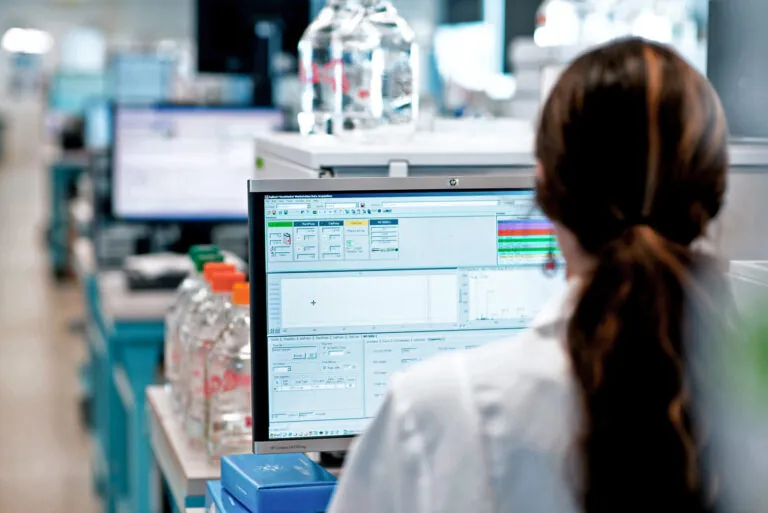 woman in a lab on a computer