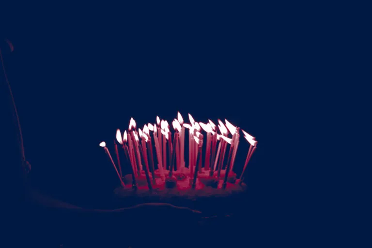birthday cake with lit candles